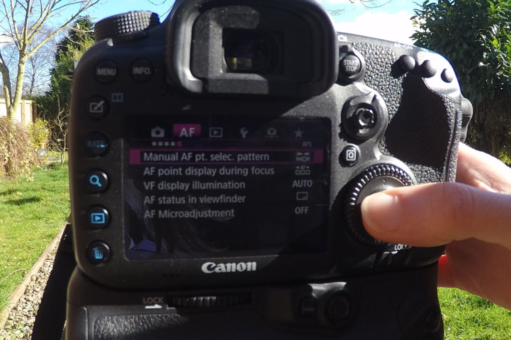 Operating the menu on the Canon EOS 7D Mark II to select options that will improve our photography